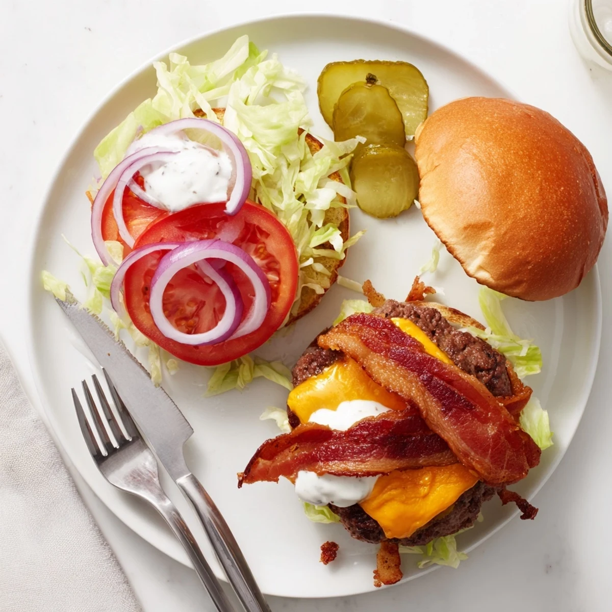 Ultimate crack burger with melty cheese crispy bacon red onion and golden brioche bun dripping with special sauce