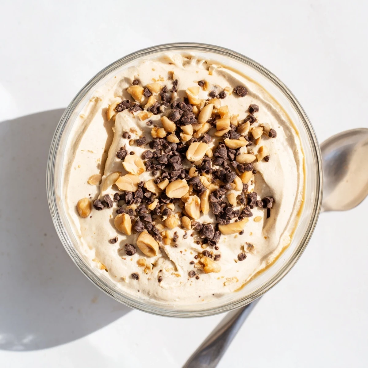 Light and fluffy peanut butter mousse dessert with Cool Whip served in elegant individual glasses with garnish.