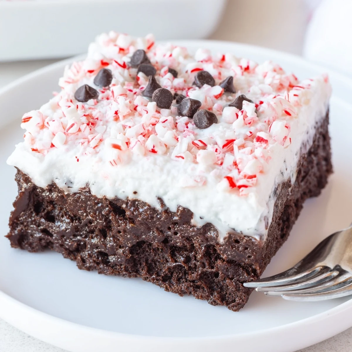 Homestyle Peppermint Poke Cake chilled in pan, minty aroma, perfect for holiday