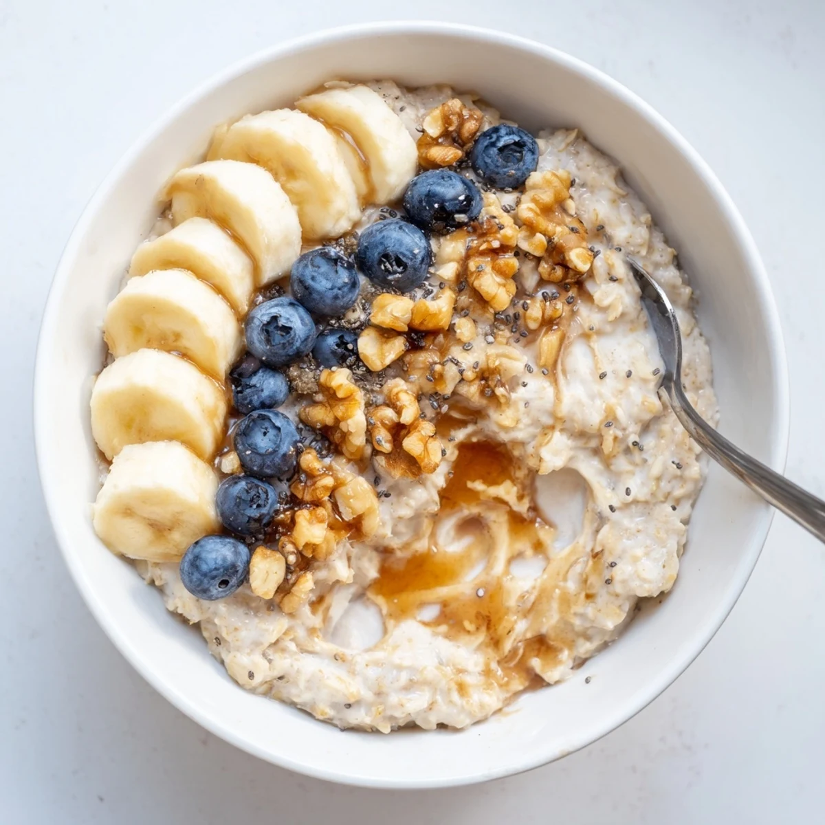 Hearty Protein Oatmeal stirred smooth with maple, nuts, and chia