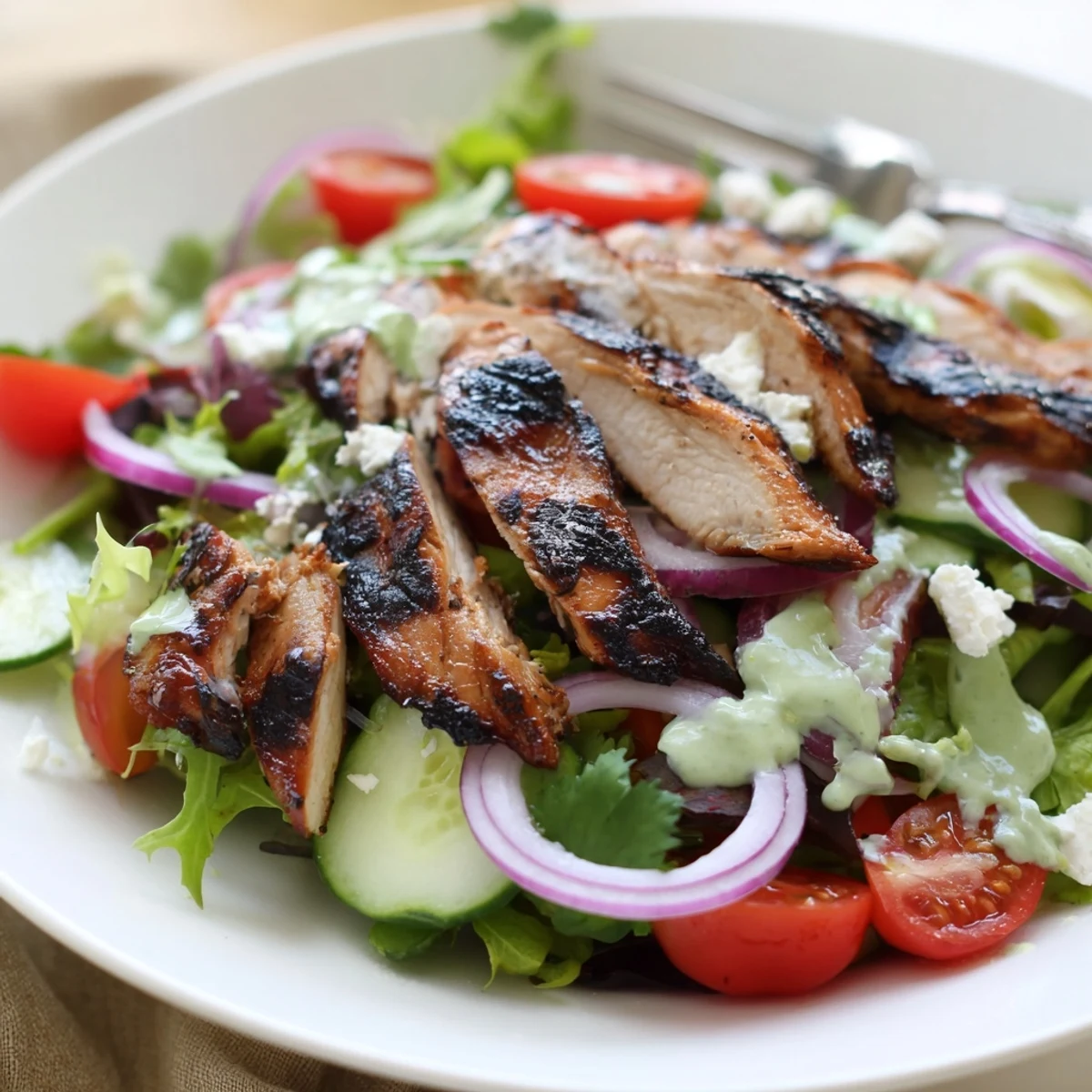 Grilled Chicken Salad Avocado Herb Dressing Recipe with sliced smoky chicken and vibrant greens.