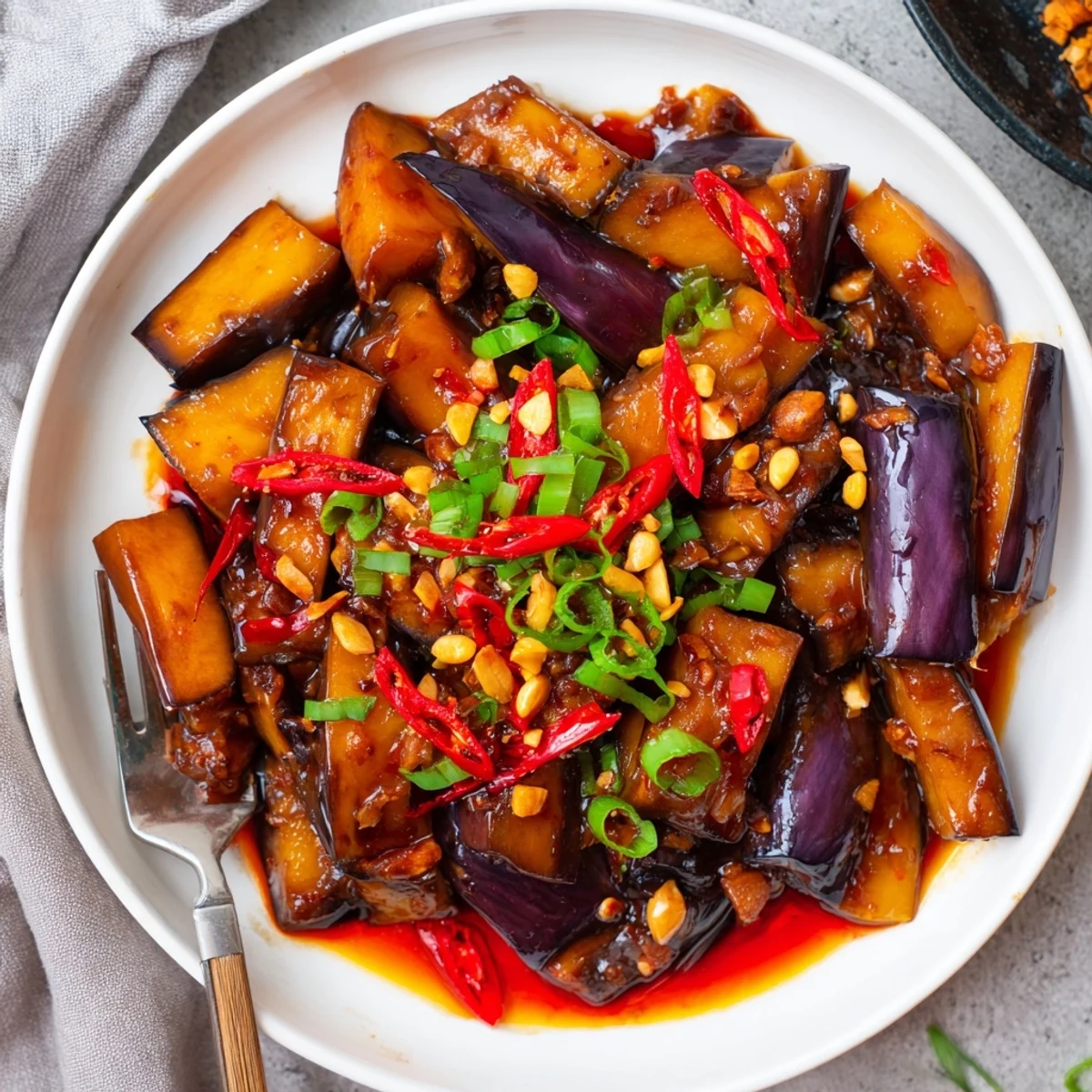 Fork-tender Sichuan Style Braised Aubergines coated in glossy doubanjiang sauce