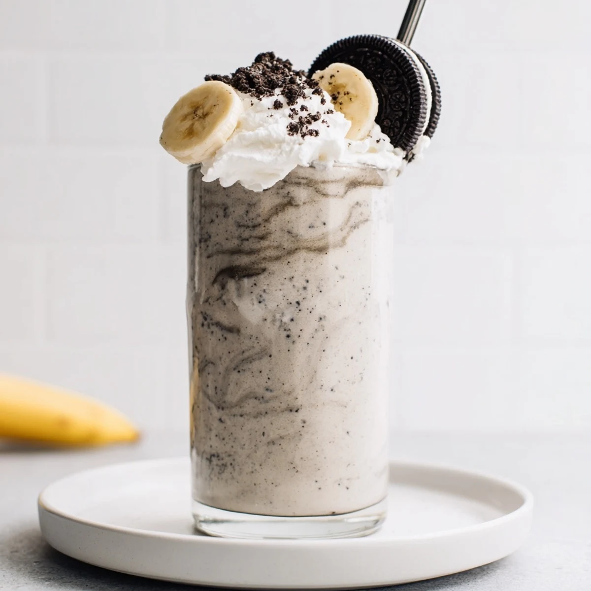 Thick Cookies And Cream Protein Shake with crushed sandwich cookies and frothy swirl