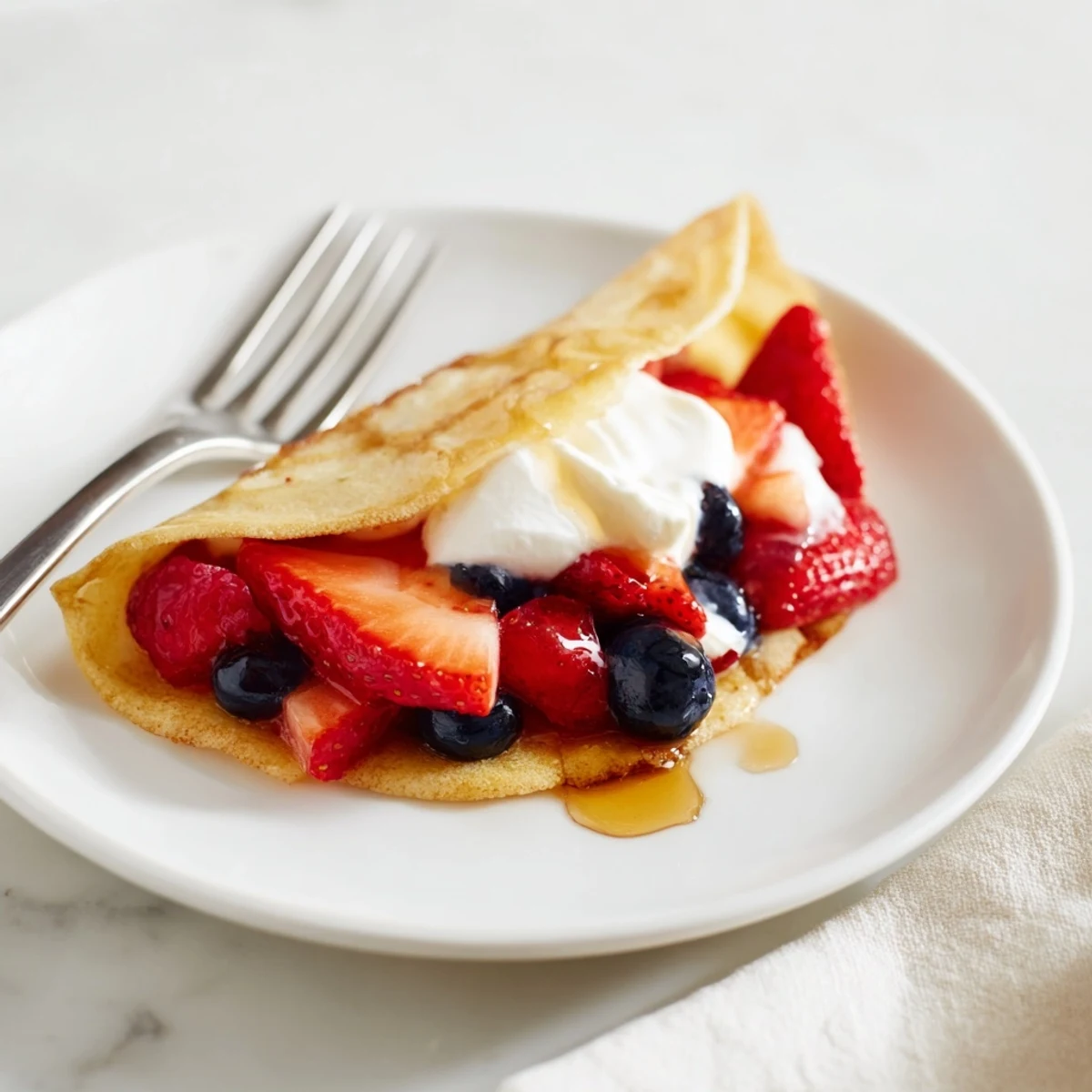Fluffy pancake tacos stuffed with scrambled eggs and bacon on a wooden board